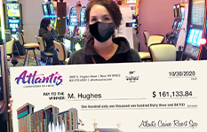 Jackpot winner Megan H. holding a check