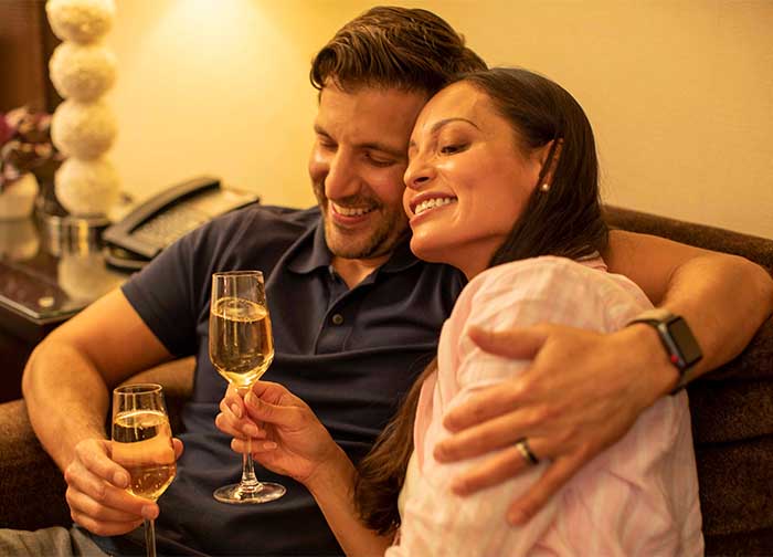 Couple drinking champagne in Atlantis hotel room