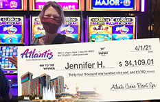 Jackpot winner Jennifer H. holding a check